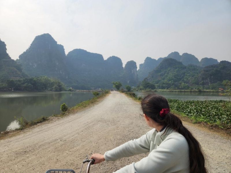 Cycling through the paddy fields near Trang An