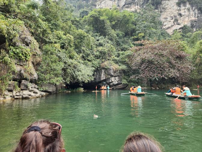 On the Trang An River going into tunnel one